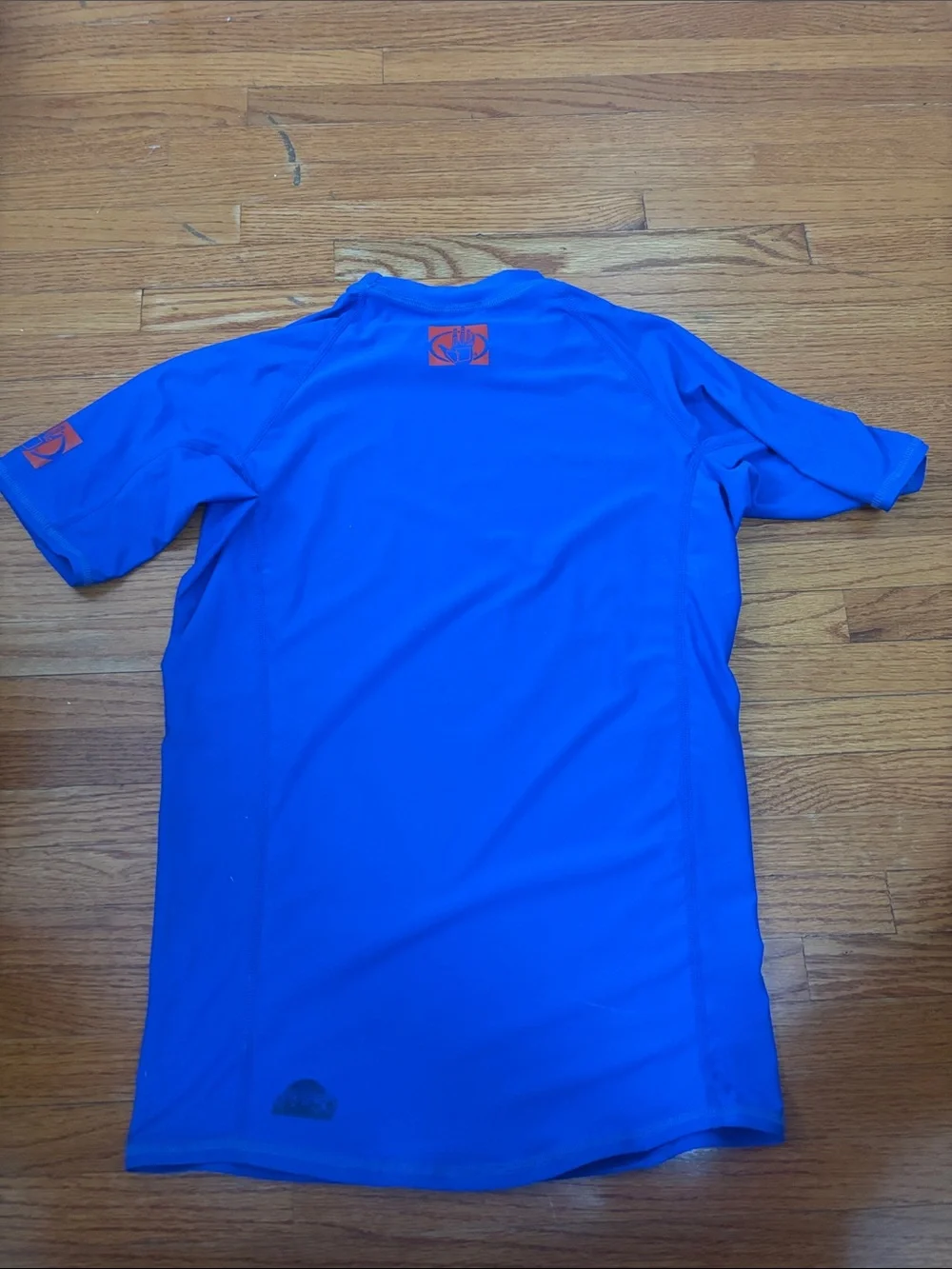 Body Glove blue and red rash guard tops
